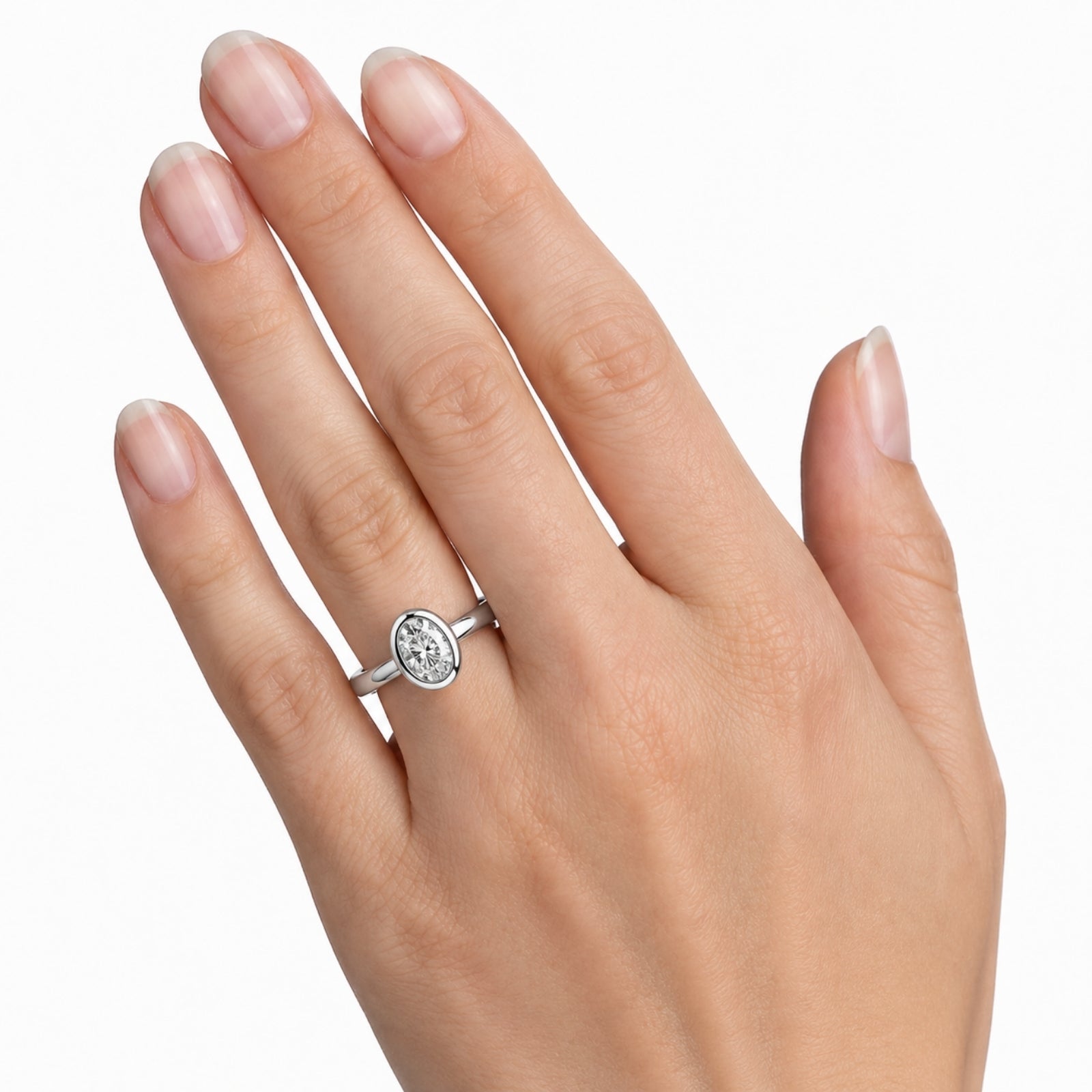 1.00-6.00 Carat T.W. Oval-cut IGI Certified Lab Grown Diamond (F/VS+) 14K Gold Bezel Set Ring