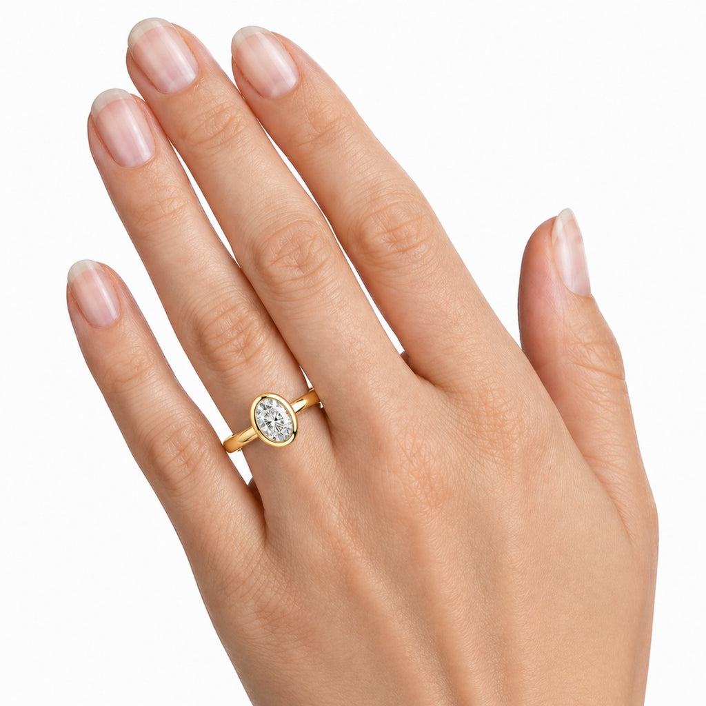 1.00-6.00 Carat T.W. Oval-cut IGI Certified Lab Grown Diamond (F/VS+) 14K Gold Bezel Set Ring