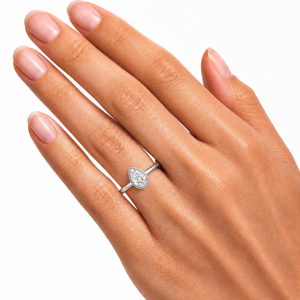1.00-6.00 Carat T.W. Pear-cut IGI Certified Lab Grown Diamond (F/VS+) 14K Gold Bezel Set Ring