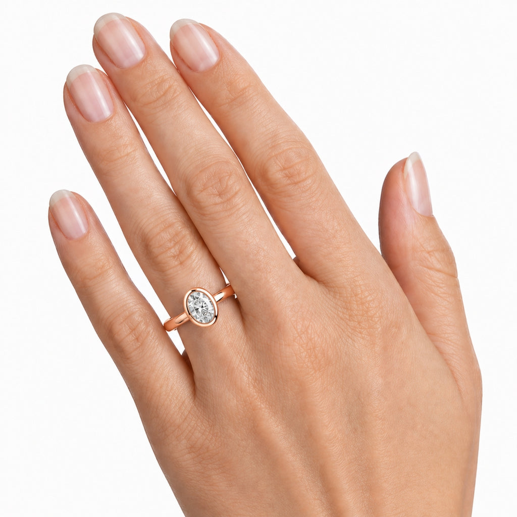 1.00-6.00 Carat T.W. Oval-cut IGI Certified Lab Grown Diamond (F/VS+) 14K Gold Bezel Set Ring
