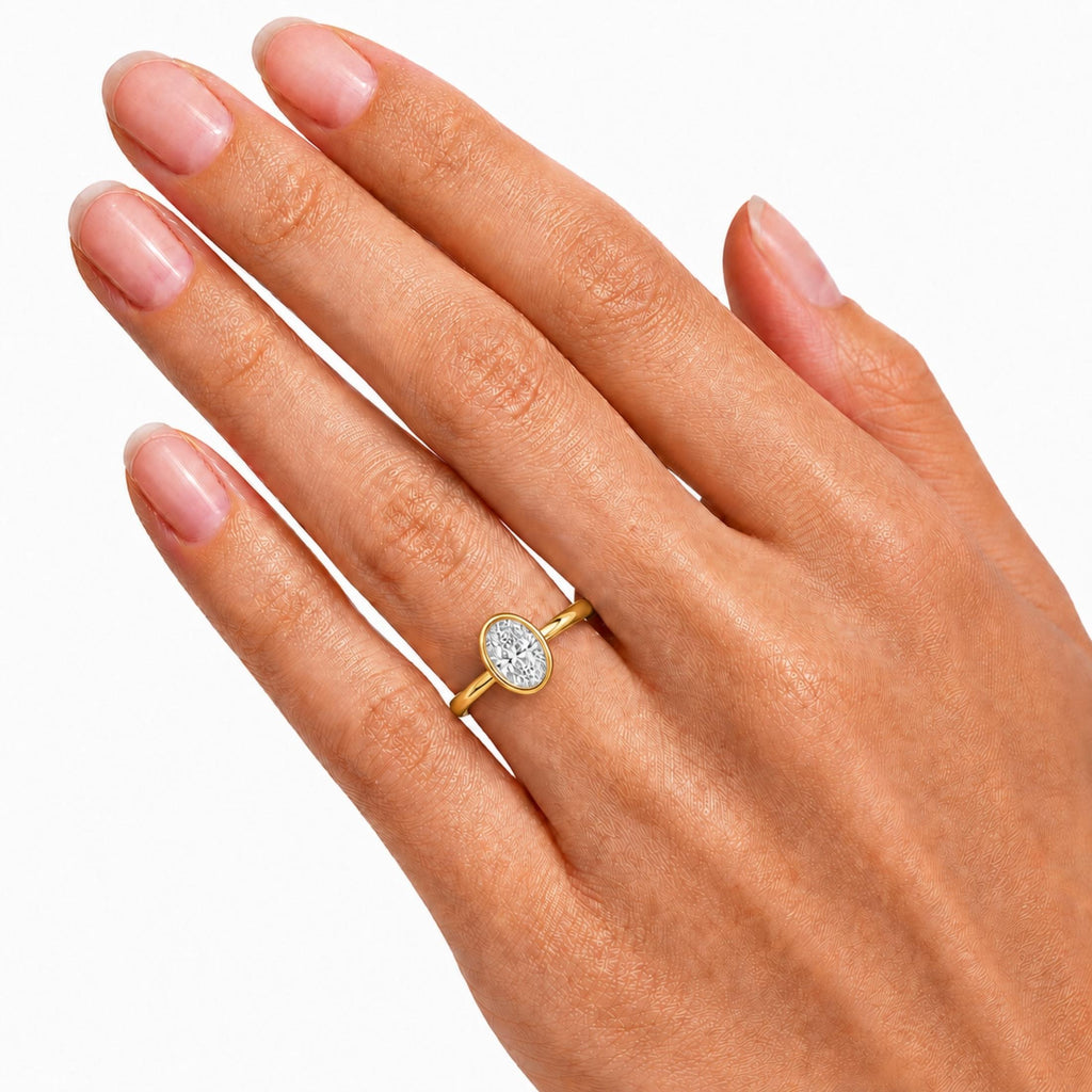 1.00-6.00 Carat T.W. Oval-cut IGI Certified Lab Grown Diamond (F/VS+) 14K Gold Bezel Set Ring
