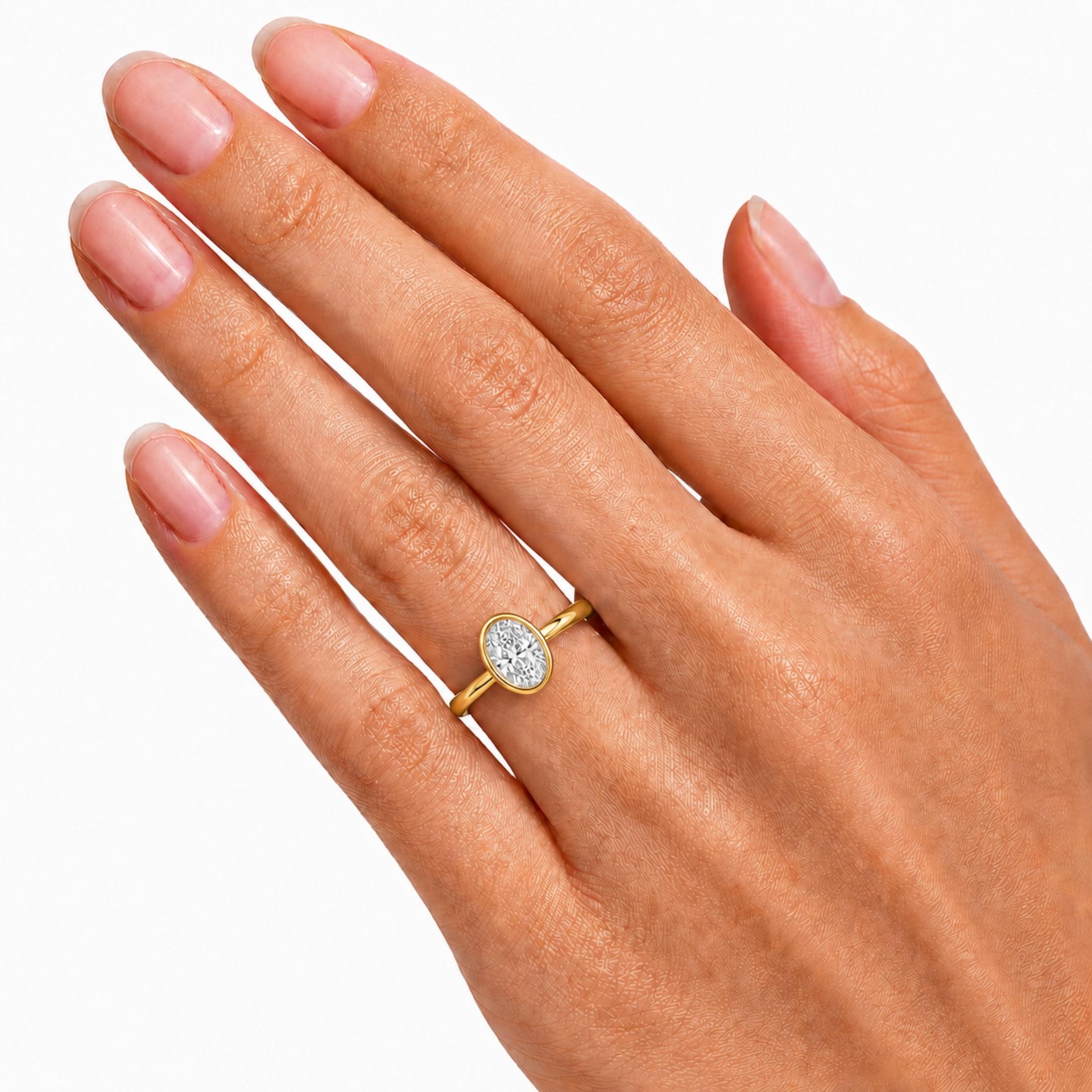 1.00-6.00 Carat T.W. Oval-cut IGI Certified Lab Grown Diamond (F/VS+) 14K Gold Bezel Set Ring