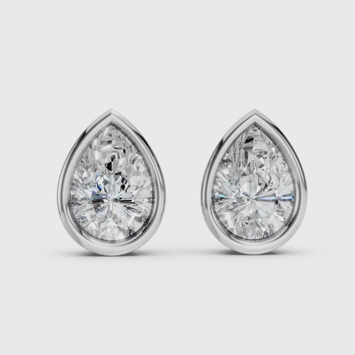 1.00 - 2.00 Carat T.W. Pear-cut Lab Grown Diamond (F/VS+) 14K Gold Bezel set Stud Earrings with Double Notch Post & Pushback