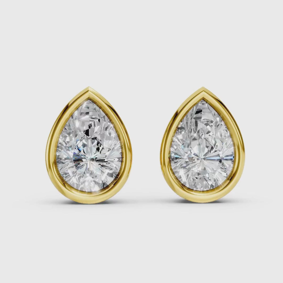 1.00 - 2.00 Carat T.W. Pear-cut Lab Grown Diamond (F/VS+) 14K Gold Bezel set Stud Earrings with Double Notch Post & Pushback