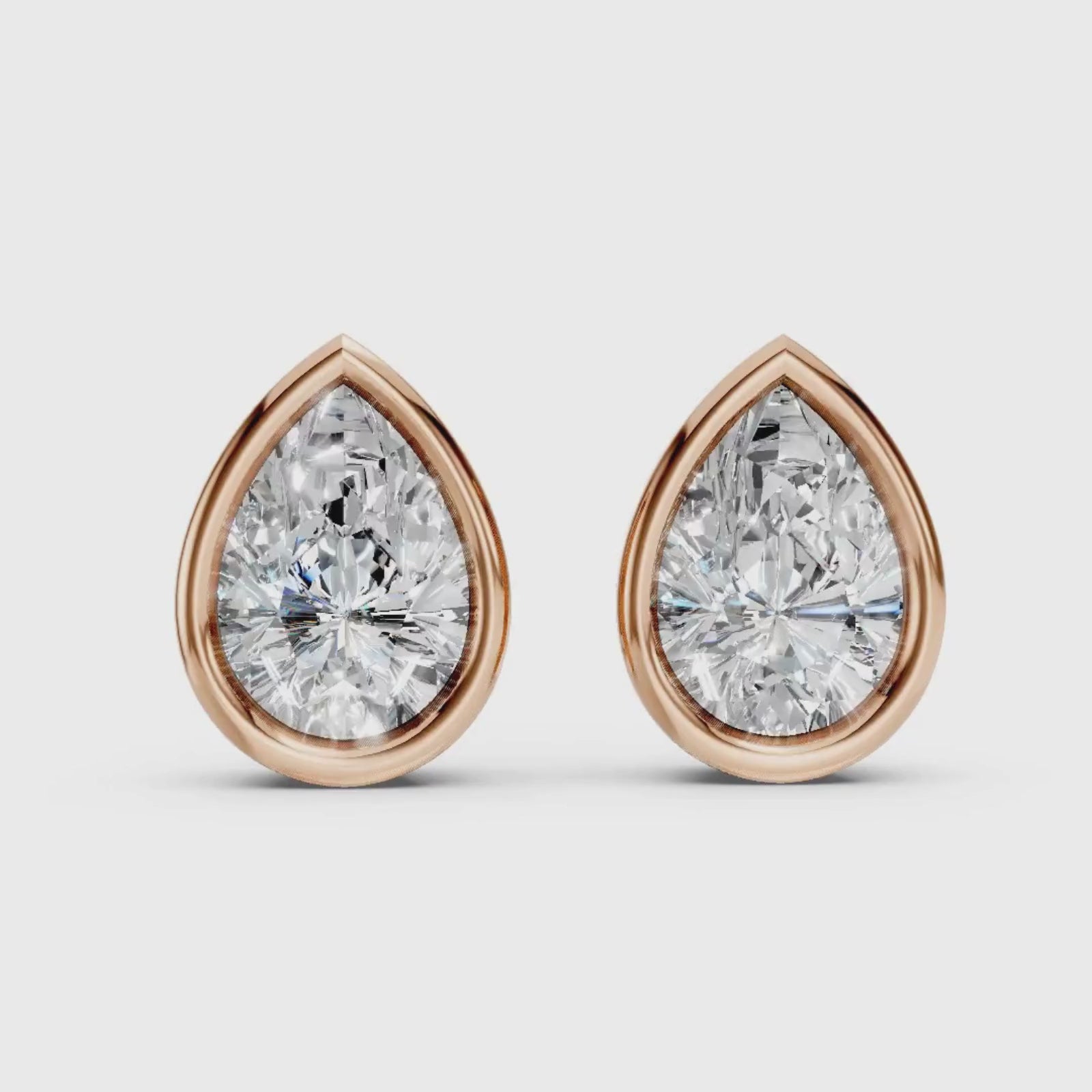 1.00 - 2.00 Carat T.W. Pear-cut Lab Grown Diamond (F/VS+) 14K Gold Bezel set Stud Earrings with Double Notch Post & Pushback